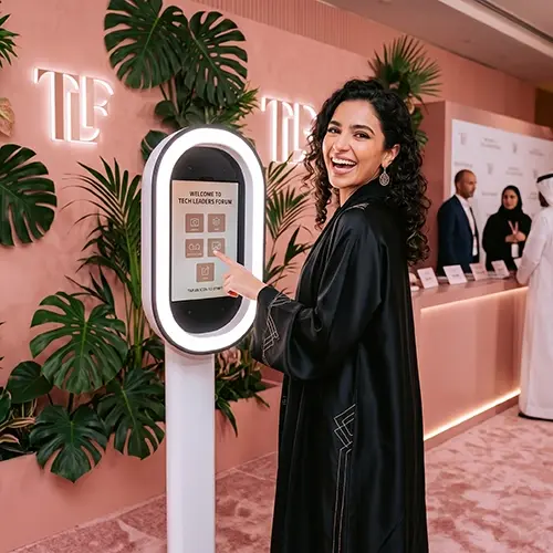 Guests having fun with quirky props inside a vintage strip photo booth by Mirror Booth Dubai.
